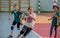 Kids play handball indoor. Sports and physical activity. Training and sports for children