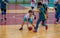 Kids play handball indoor. Sports and physical activity. Training and sports for children