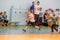 Kids play handball indoor. Sports and physical activity. Training and sports for children