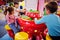 Kids play with kinetic sand in indoor play center