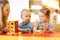 Kids play with montessori toys in classroom