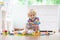 Kids play wooden railway. Child with toy train