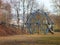 Kids playgroung with blue climbing structure and ropes