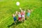 Kids playing ball on a meadow