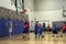 Kids playing basketball match