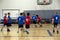 Kids playing basketball match