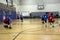 Kids playing basketball match