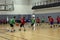 Kids playing basketball match