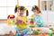 Kids playing with blocks together. Educational toys for preschool and kindergarten child. Little girls build toys at