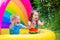 Kids playing in inflatable pool