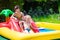 Kids playing in inflatable pool