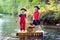 Kids playing pirate adventure on wooden raft