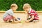 Kids Playing in Sand, Two Children Boys Outdoor Leisure in Sandbox