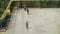 Kids playing soccer on urban parking