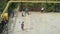Kids playing soccer on urban parking