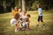 Kids playing together. Large group of school kids having fun in nature