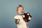 Kids playing with toys. Happy child veterinarian smile with teddy bear on blue background