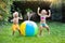 Kids playing with water ball toy sprinkler