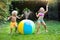 Kids playing with water ball toy sprinkler