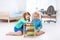 Kids playing with wooden abacus. Educational toy.