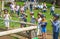 Kids practicing with the catapult in the Norman village. Reconstruction of medieval period 1050, educational centre for kids with