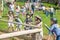 Kids practicing with the catapult in the Norman village. Reconstruction of medieval period 1050, educational centre for kids with