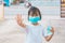 Kids protect coronavirus by wearing mask and 75 percent alcohol and working in the home