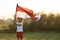 Kids raising indonesian flag