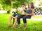 Kids reading a book in a park