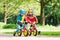 Kids ride balance bike in park