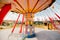 Kids riding on colorful amusement carousel