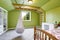 Kids room in bright green with hanging chair