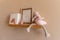 Kids room decor, wooden floating shelf interior child bedroom, empty wooden picture frame, books, blank canvas