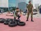 Kids running military obstacle course