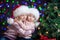 Kids in Santa hat on bright festive background