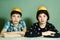 Kids siblings peeling grape fruit make funny hat