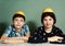 Kids siblings peeling grape fruit make funny hat