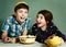 Kids siblings peeling grape fruit make funny hat