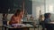 Kids sitting at desks in classroom. Clever pupils raising hands at lesson