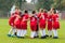 Kids soccer team in huddle