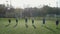 Kids soccer team during warm up on football field
