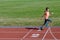 Kids sport, child running on stadium track, training and fitness