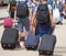 Kids on the street with luggage