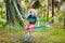 Kids on swing. Playground in tropical resort