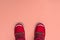 Kids or teenage pink winter boots isolated on pink background. Winter boots for girls. Top view banner