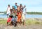 Kids and teens posing on bank of sea in Manokwari