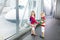 Kids travel and fly. Child at airplane in airport