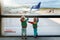 Kids travel and fly. Child at airplane in airport