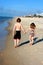 Kids walking on beach