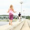 Kids walking on railing of dam